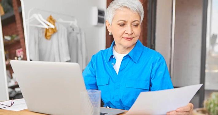 woman paying bill on computer